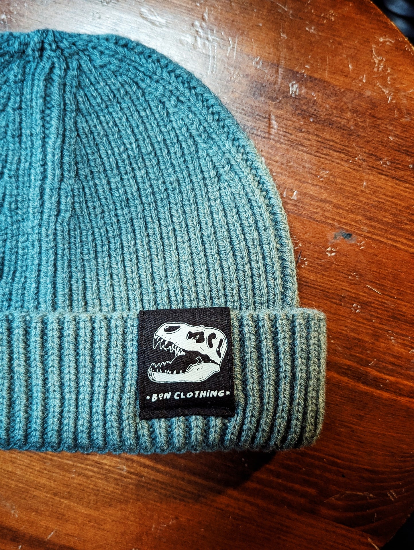 RECYCLED, ORGANIC HARBOUR STYLE BEANIES WITH T-REX PATCH.
