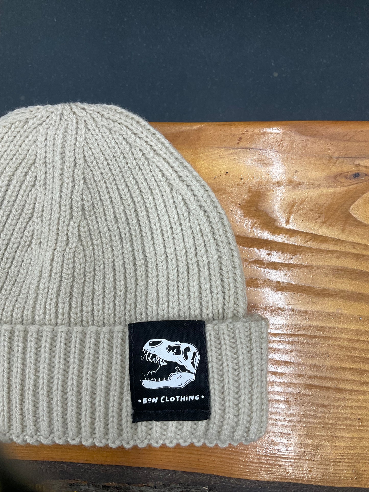 RECYCLED, ORGANIC HARBOUR STYLE BEANIES WITH T-REX PATCH.