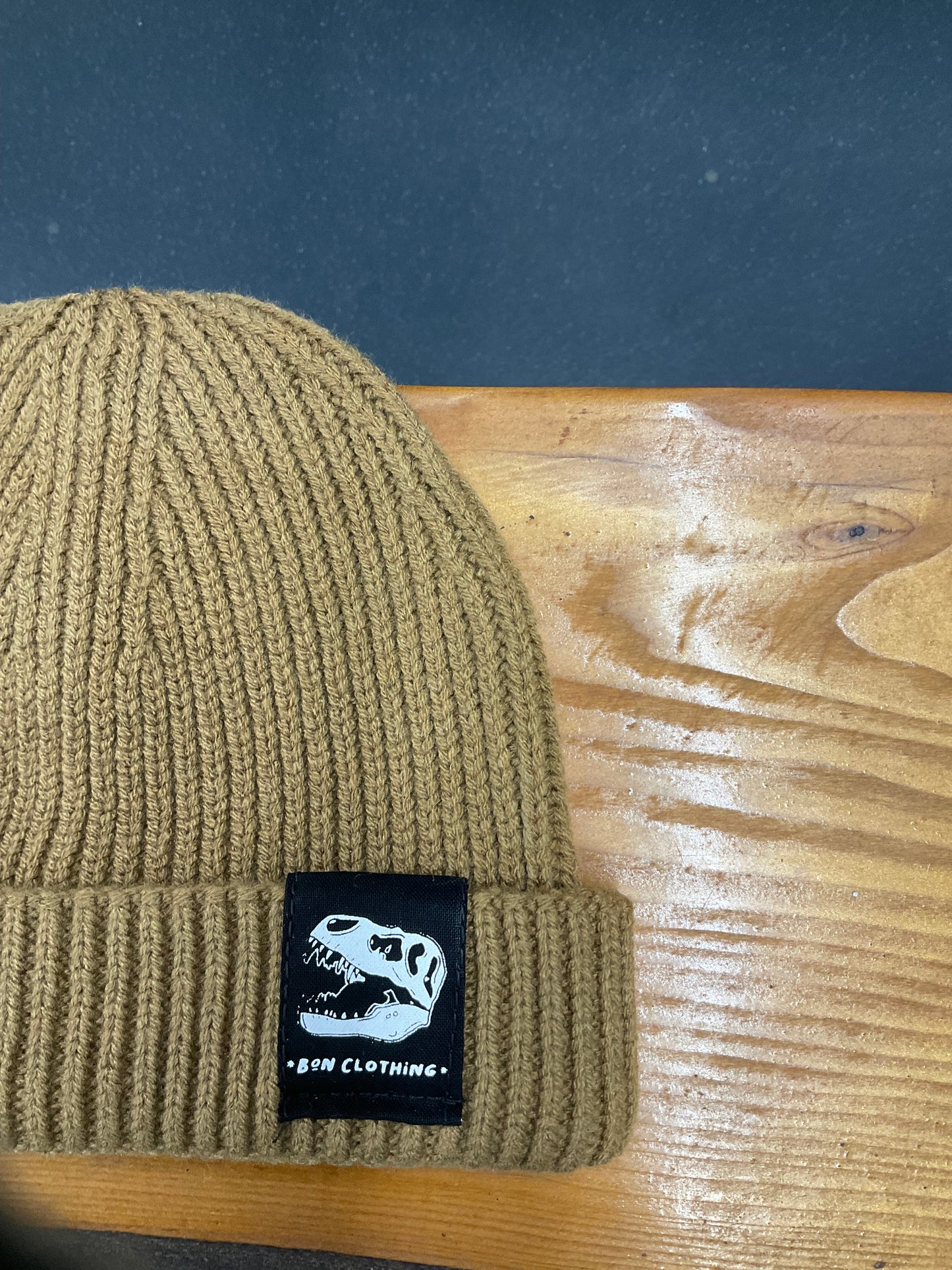 RECYCLED, ORGANIC HARBOUR STYLE BEANIES WITH T-REX PATCH.