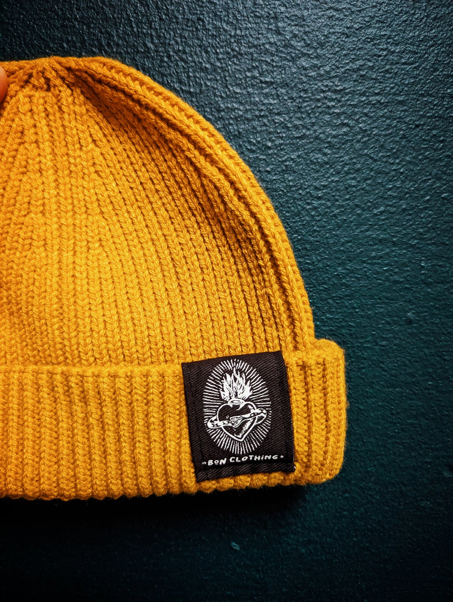 RECYCLED, ORGANIC HARBOUR STYLE BEANIES WITH SACRED HEART PATCH.