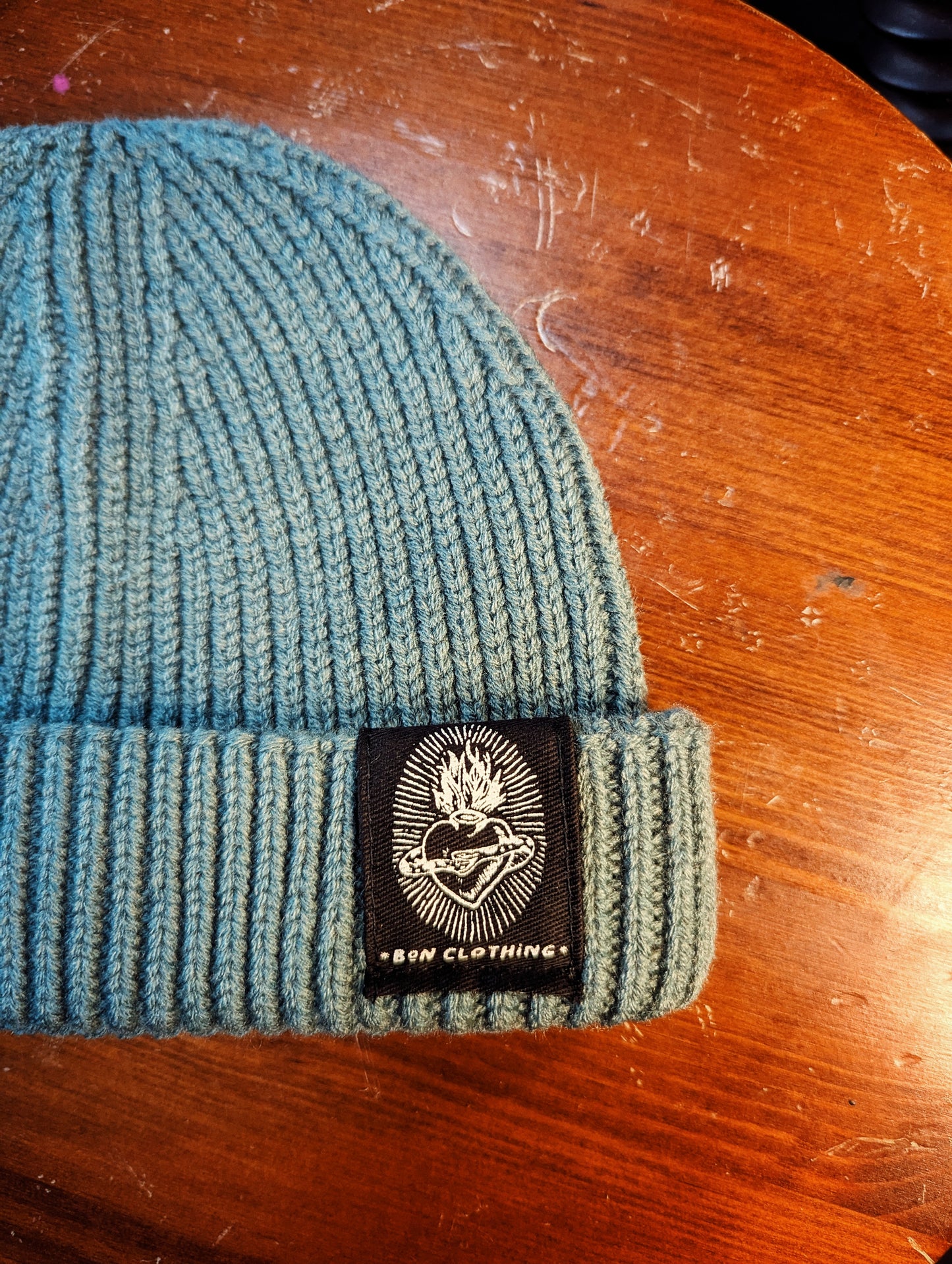 RECYCLED, ORGANIC HARBOUR STYLE BEANIES WITH SACRED HEART PATCH.