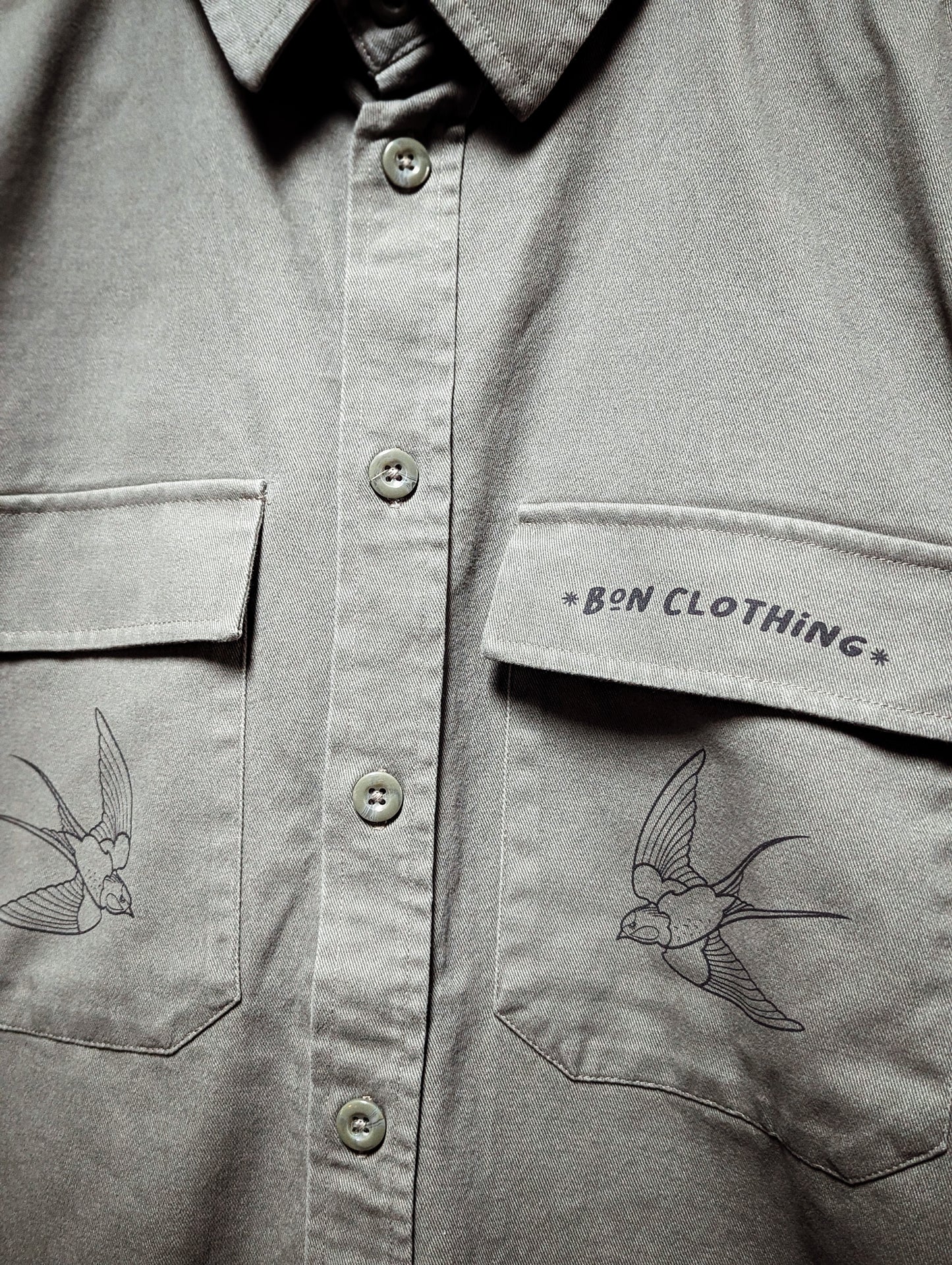 OLIVE OVERSHIRT WITH TRADTIONAL TATTOO SWALLOWS.